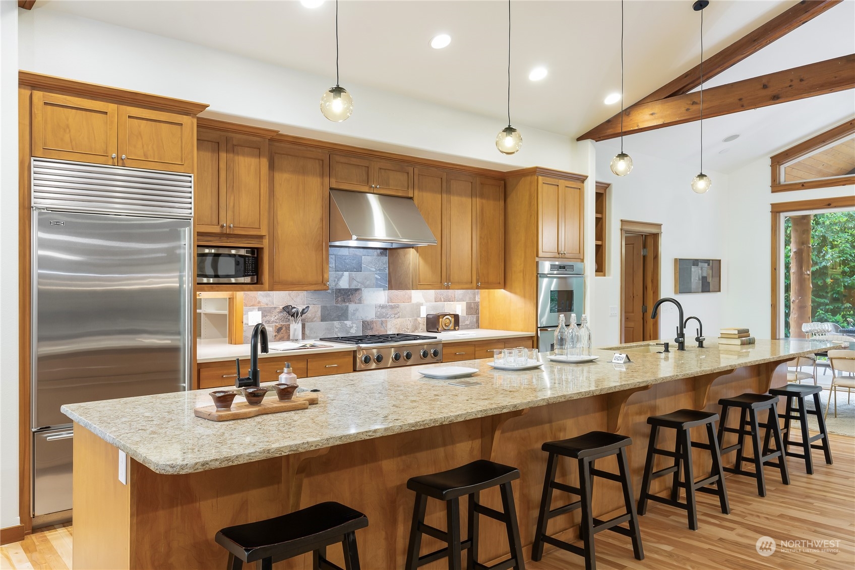 11417 Kelly Road Northeast Carnation, WA 98014 - Photo 12 of 38 a kitchen with counter space a sink and chairs