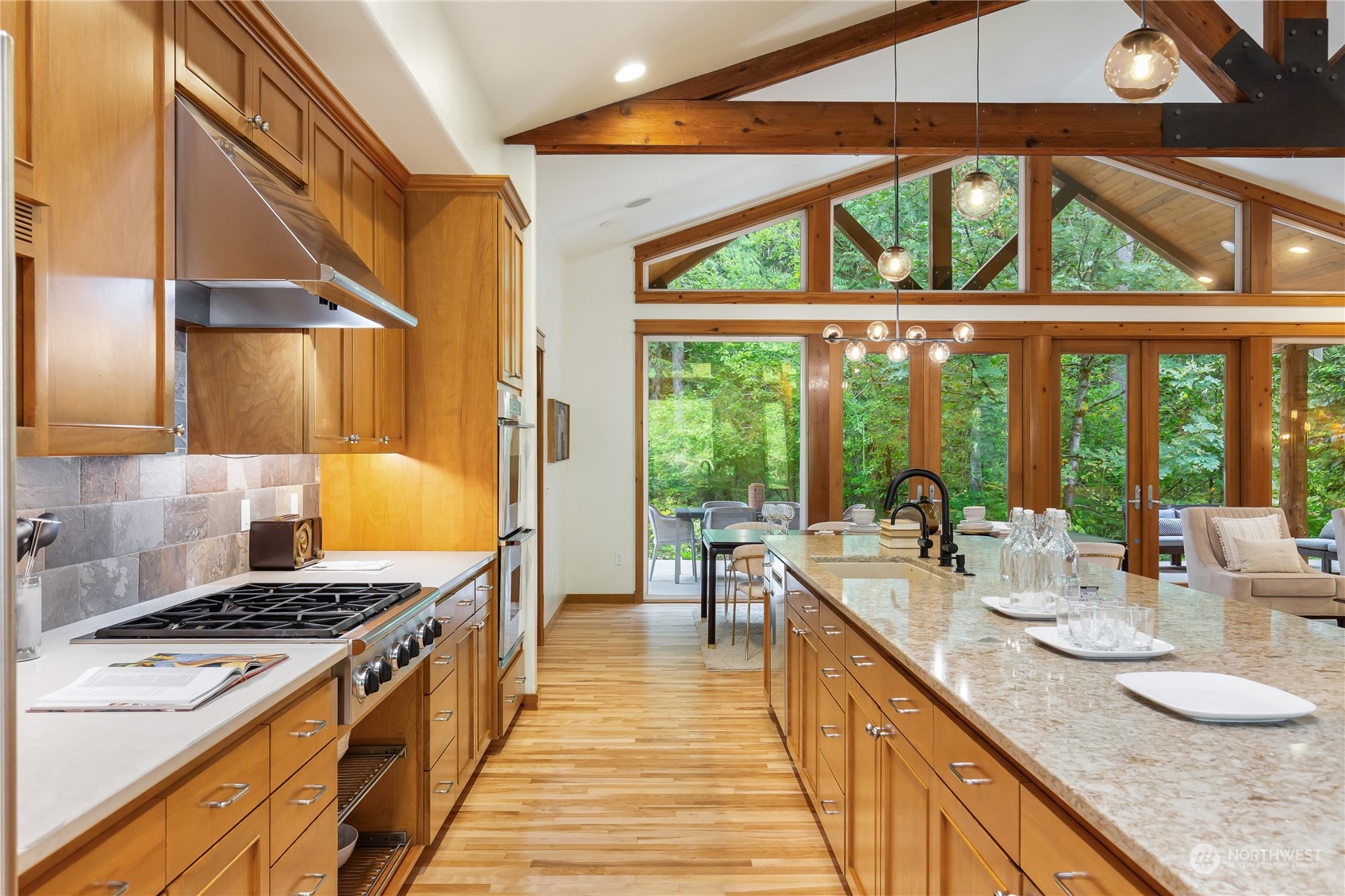 11417 Kelly Road Northeast Carnation, WA 98014 - Photo 13 of 38 a kitchen with kitchen island a large window in it