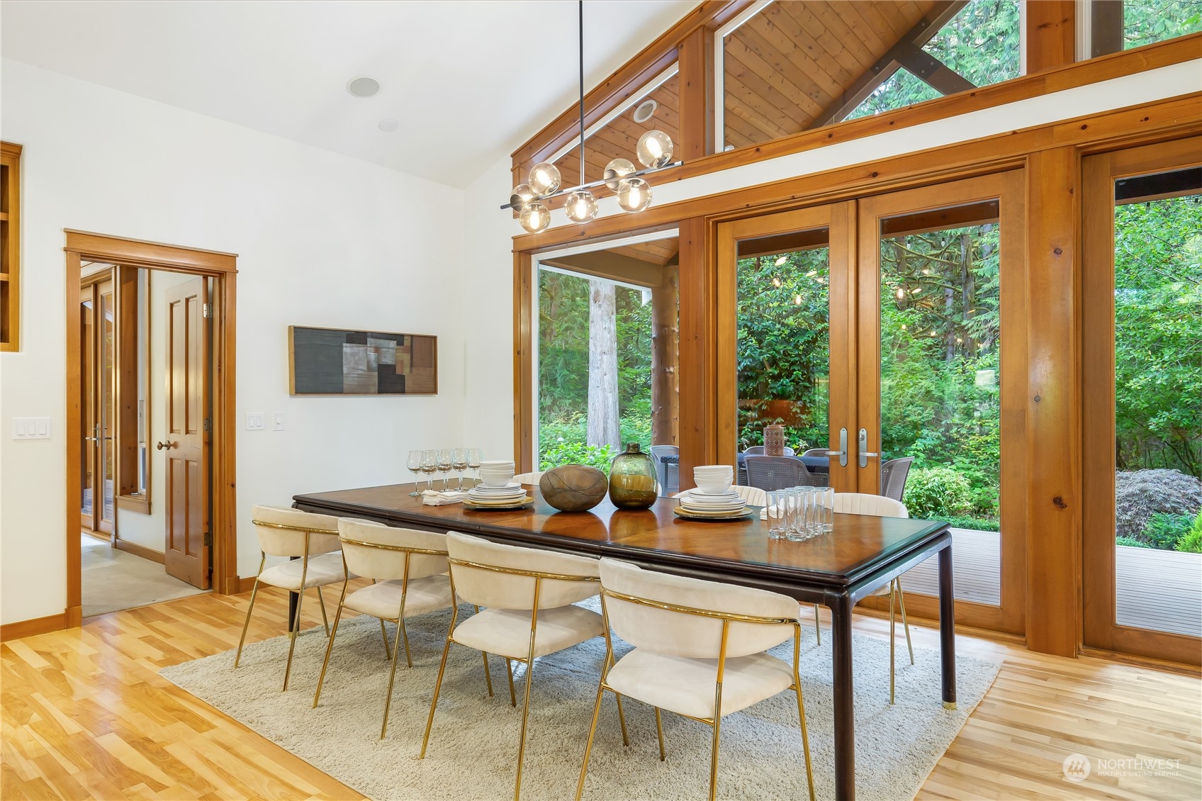 11417 Kelly Road Northeast Carnation, WA 98014 - Photo 14 of 38 a dining room with furniture and large windows