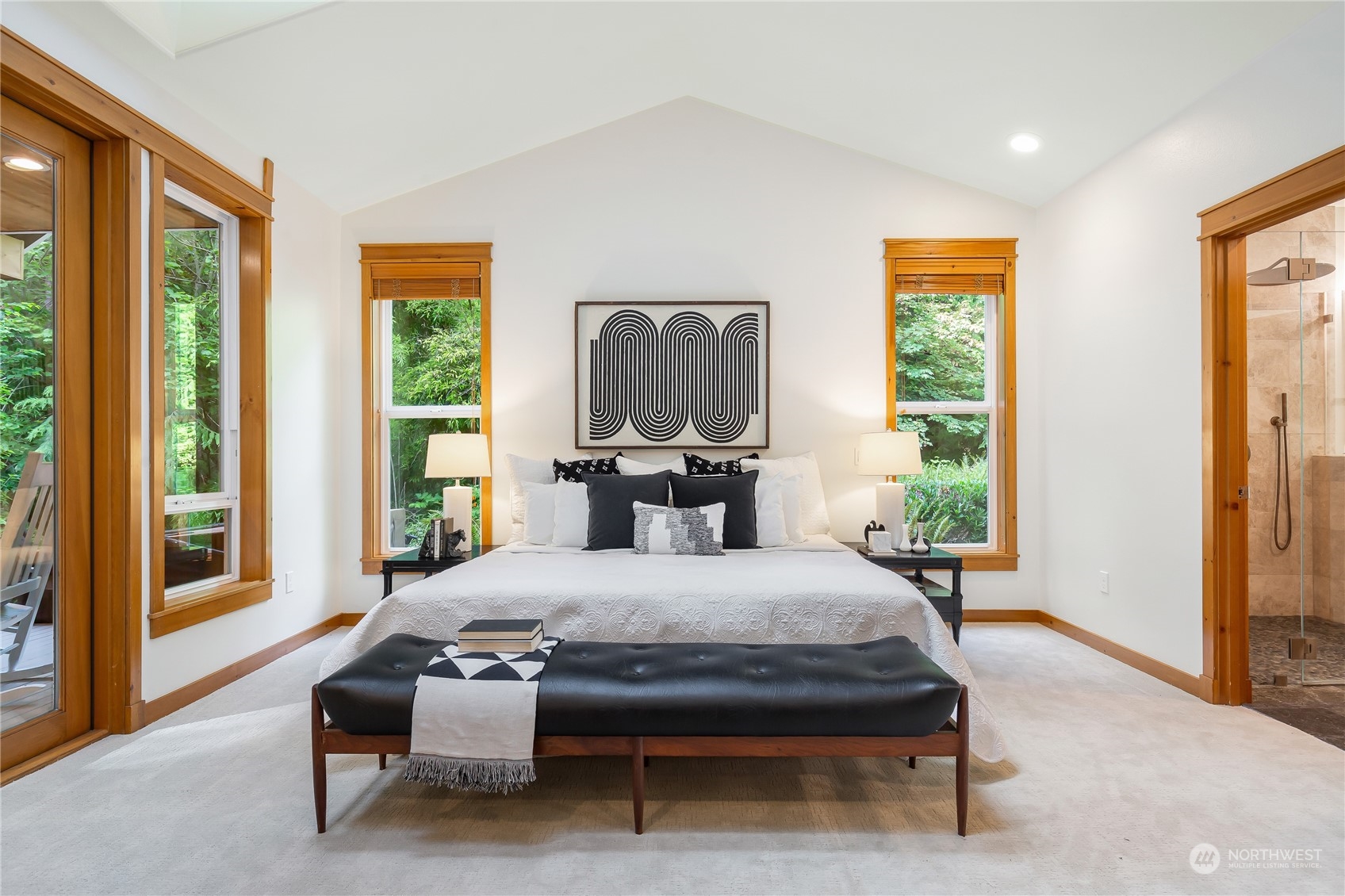 11417 Kelly Road Northeast Carnation, WA 98014 - Photo 18 of 38 a bedroom with a bed and large window