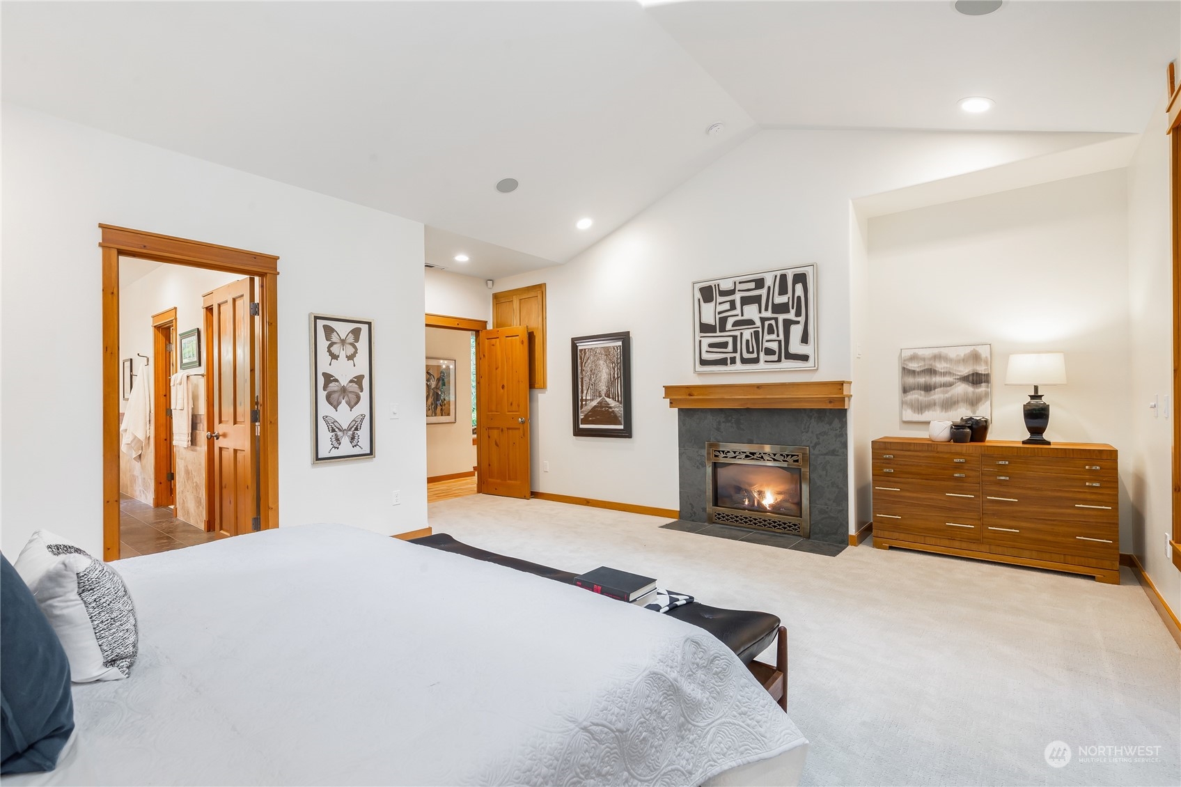 11417 Kelly Road Northeast Carnation, WA 98014 - Photo 20 of 38 a bedroom with furniture and a fireplace