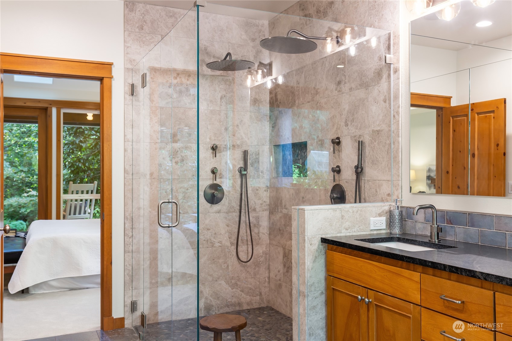 11417 Kelly Road Northeast Carnation, WA 98014 - Photo 22 of 38 a bathroom with a granite countertop sink a toilet and shower