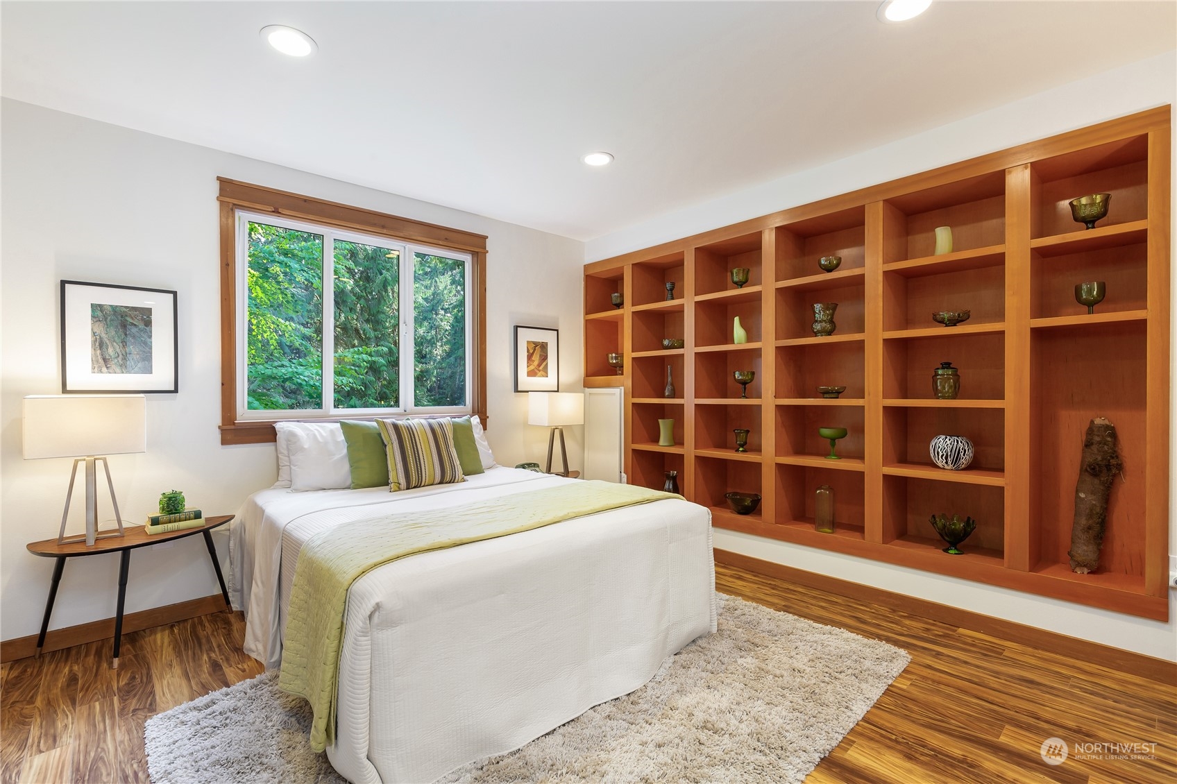11417 Kelly Road Northeast Carnation, WA 98014 - Photo 23 of 38 a large bedroom with a bed and wooden floor