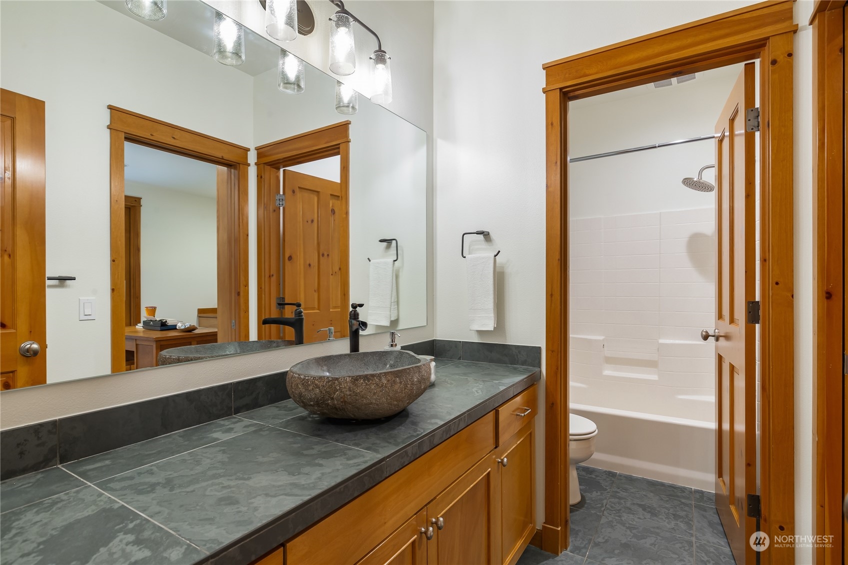 11417 Kelly Road Northeast Carnation, WA 98014 - Photo 28 of 38 a spacious bathroom with a tub and a large mirror