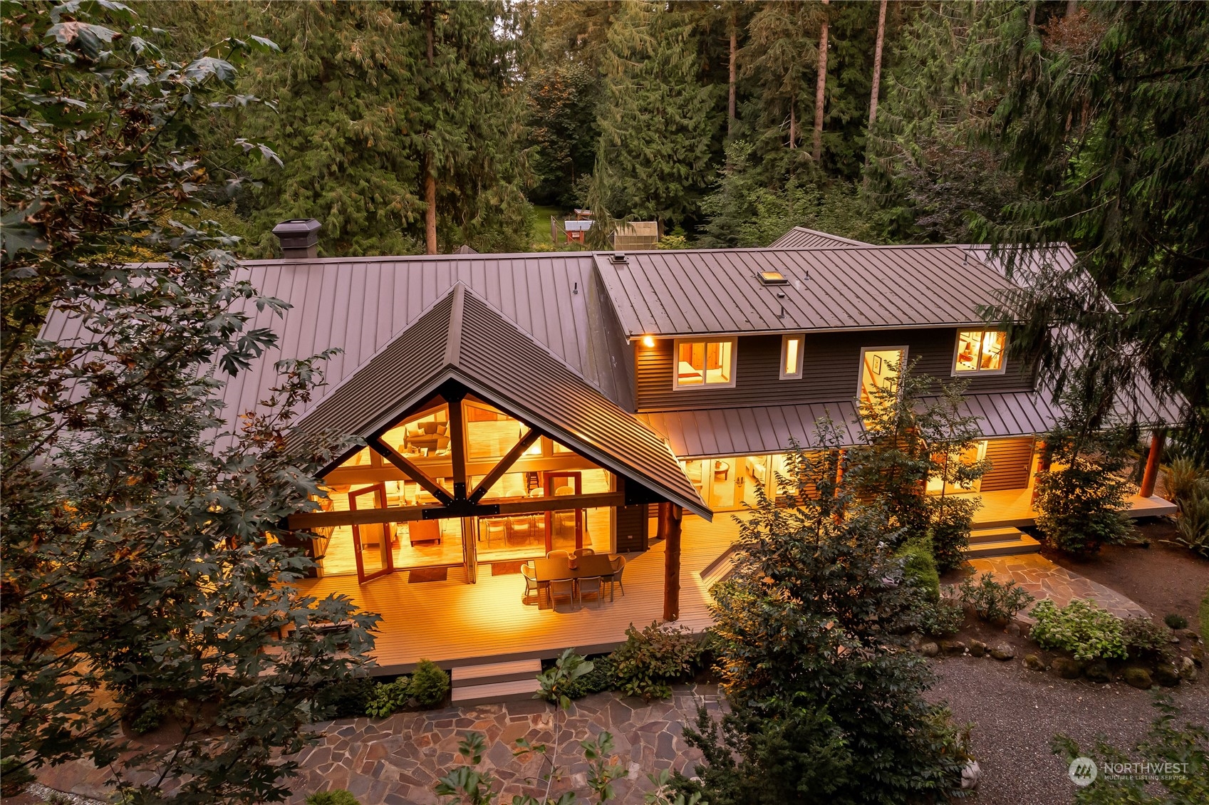 11417 Kelly Road Northeast Carnation, WA 98014 - Photo 3 of 38 a view of a house with a yard potted plants and large tree