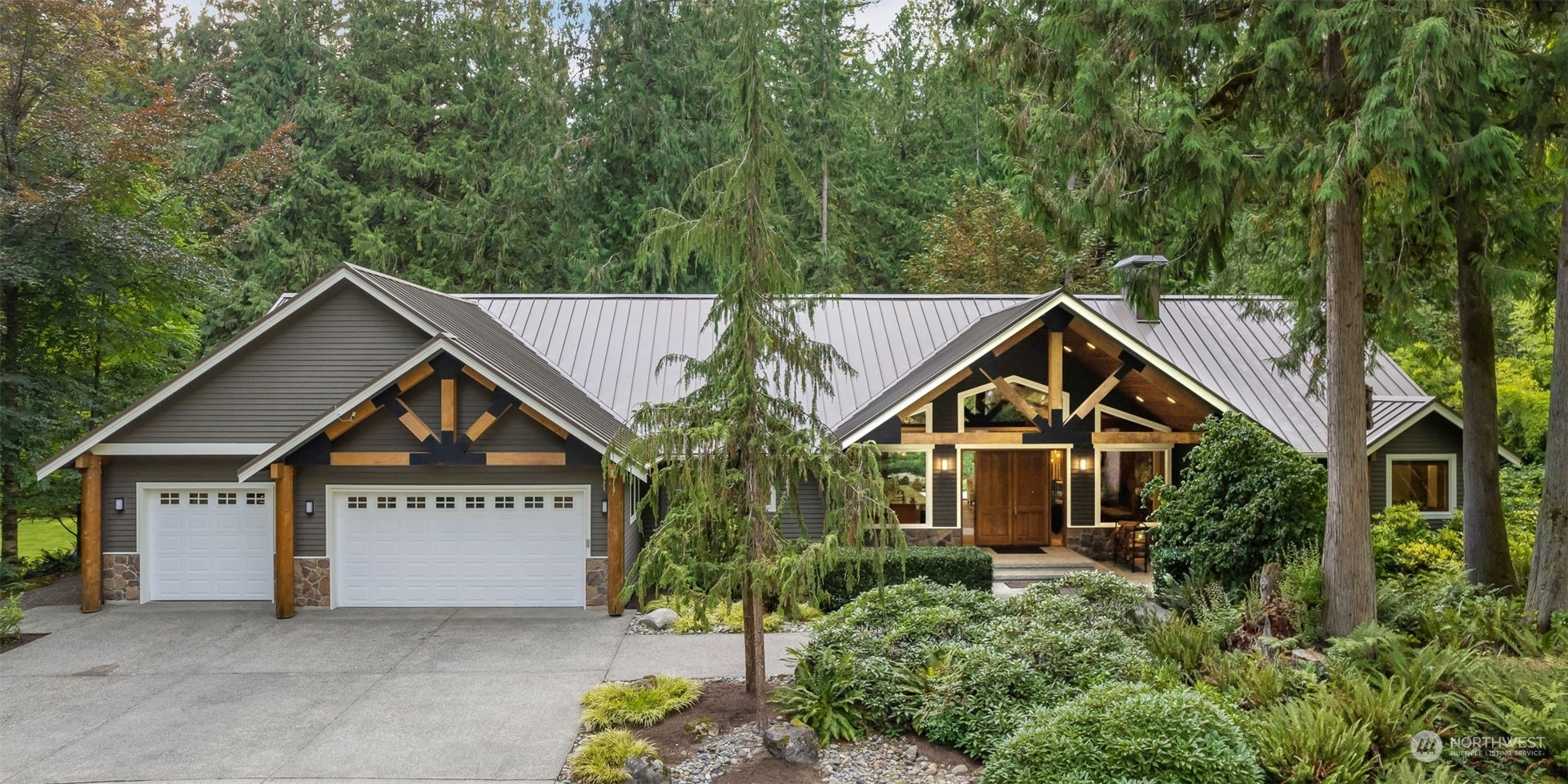11417 Kelly Road Northeast Carnation, WA 98014 - Photo 38 of 38 a front view of a house with a yard and garage
