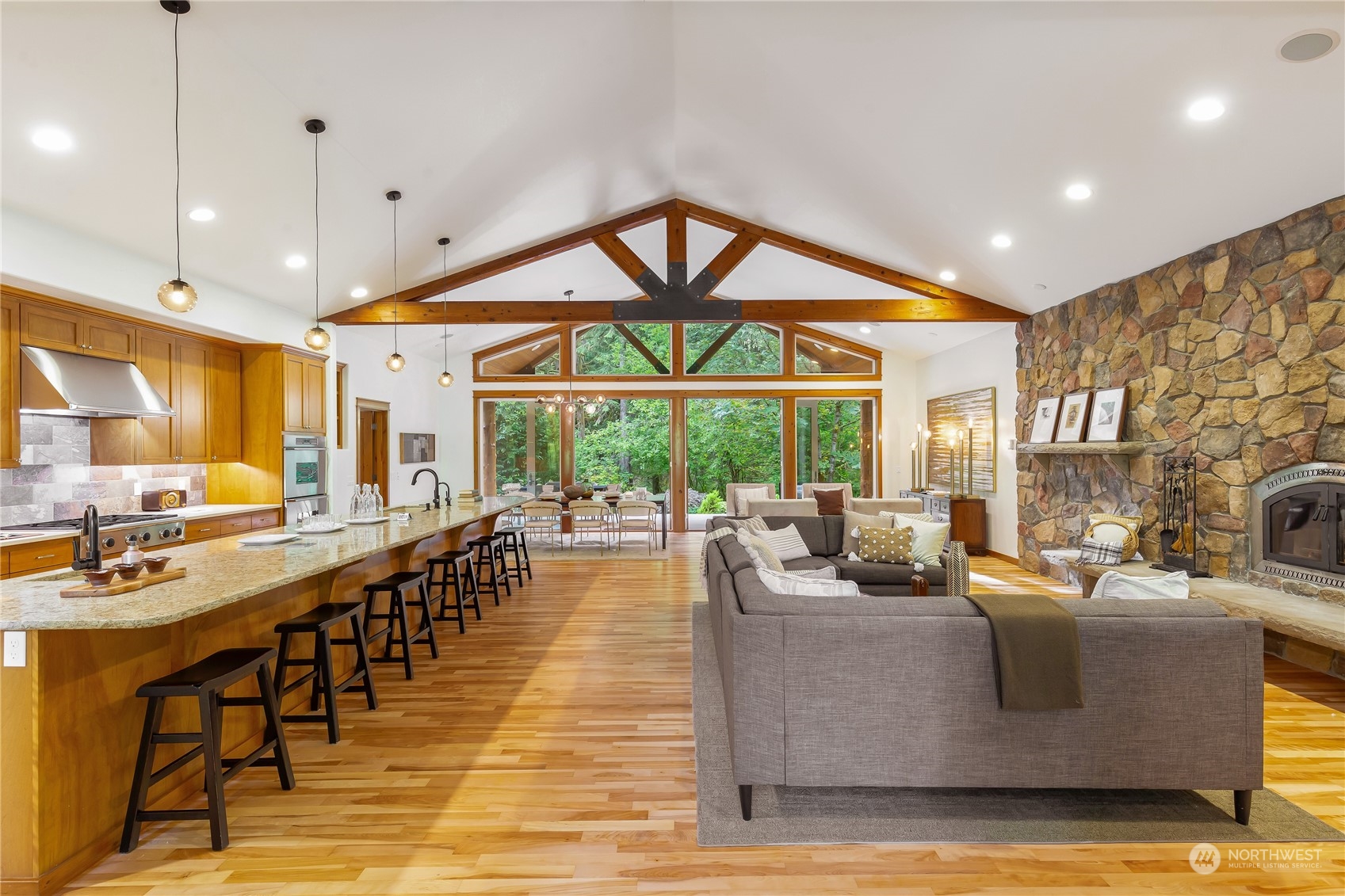 11417 Kelly Road Northeast Carnation, WA 98014 - Photo 6 of 38 a living room with fireplace furniture and a large window