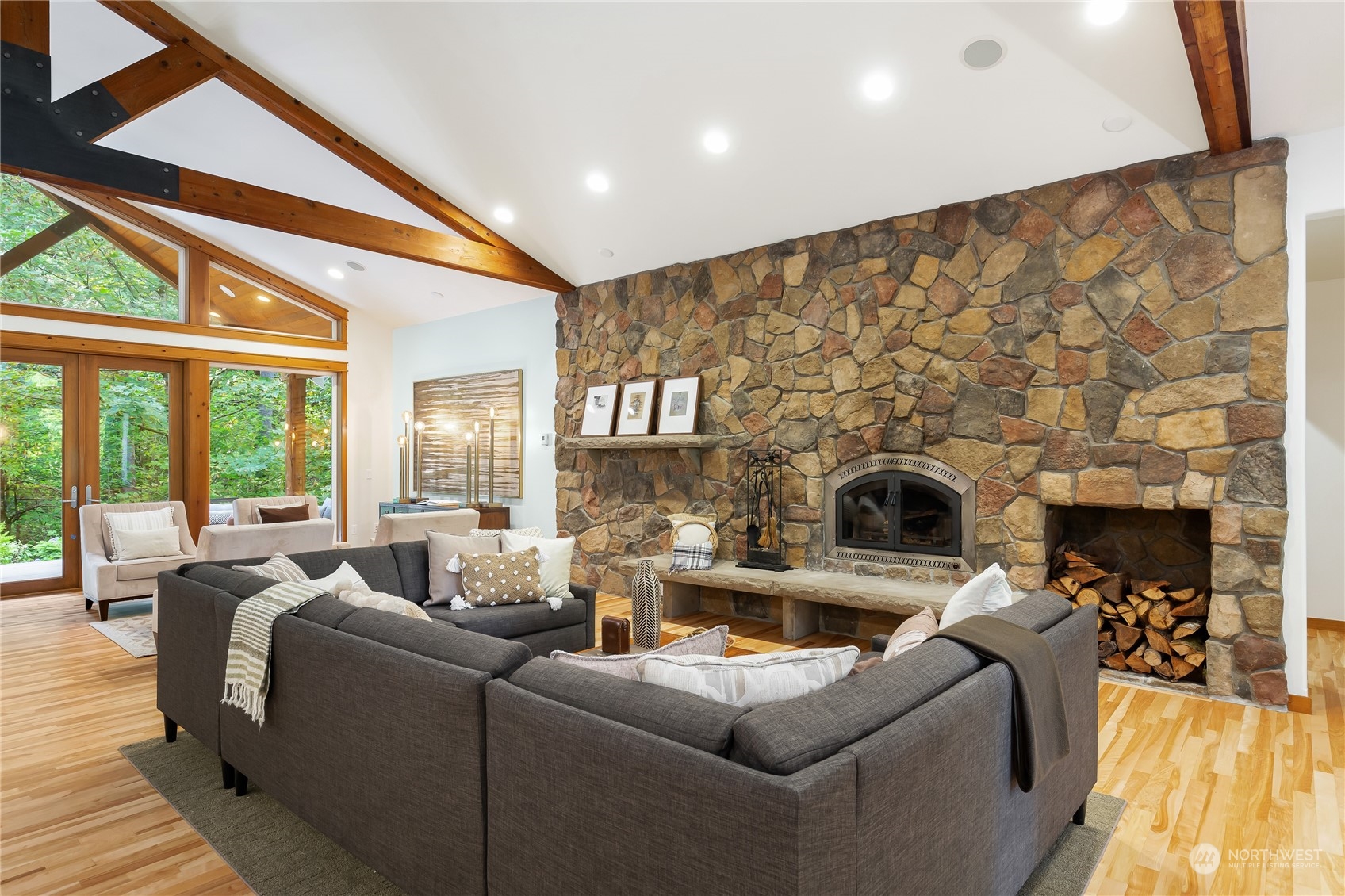 11417 Kelly Road Northeast Carnation, WA 98014 - Photo 7 of 38 a living room with fireplace furniture and a floor to ceiling window