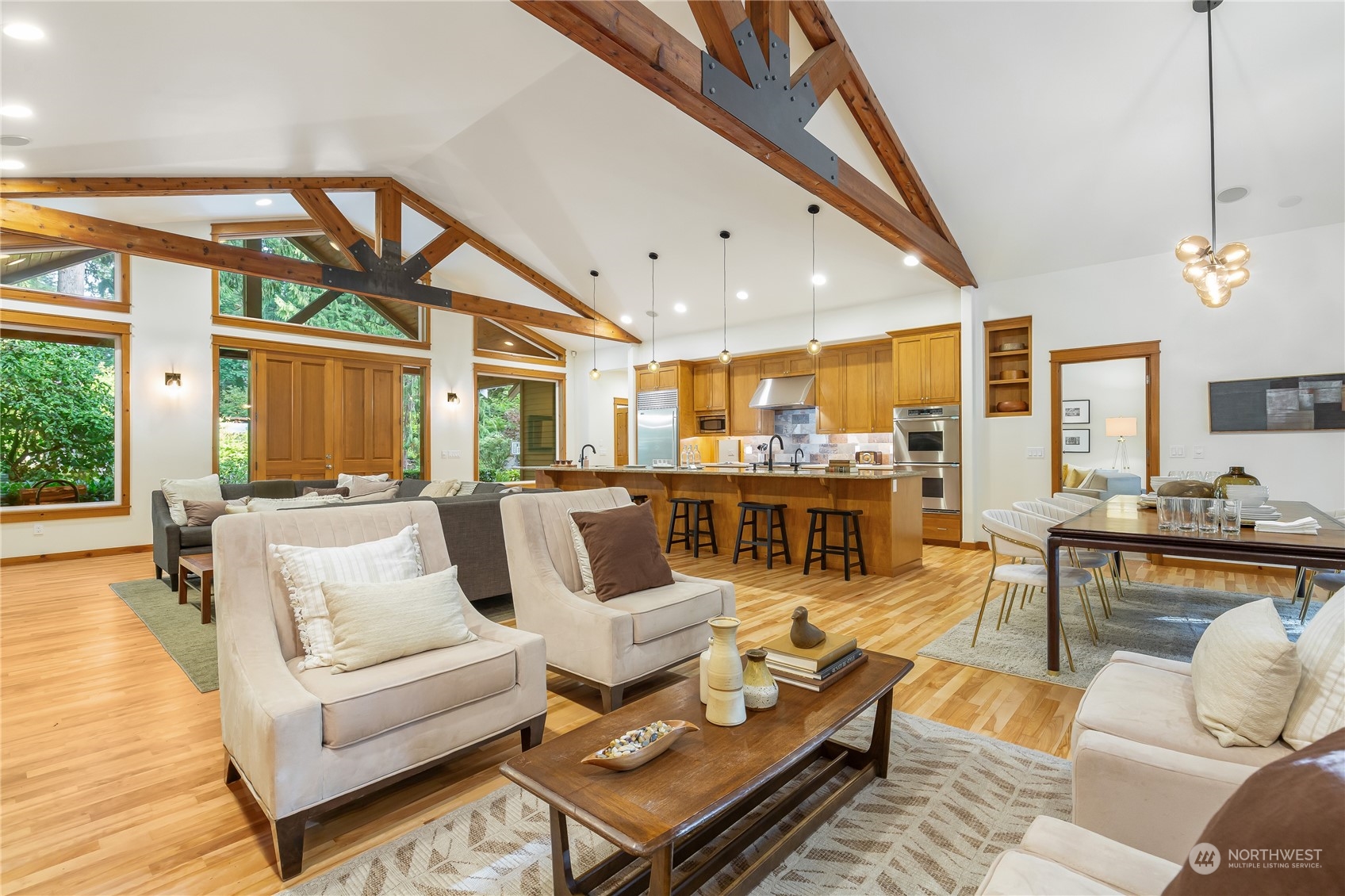 11417 Kelly Road Northeast Carnation, WA 98014 - Photo 10 of 38 a living room with furniture a fireplace and a large window
