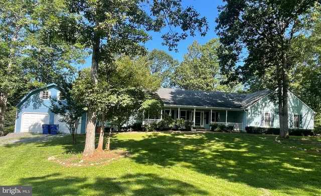 a kitchen with stainless steel appliances a stove a sink and a microwave