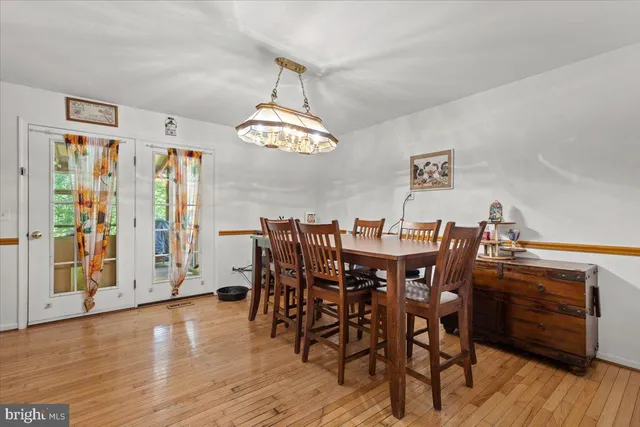 a bathroom with a sink a mirror a toilet and a shower