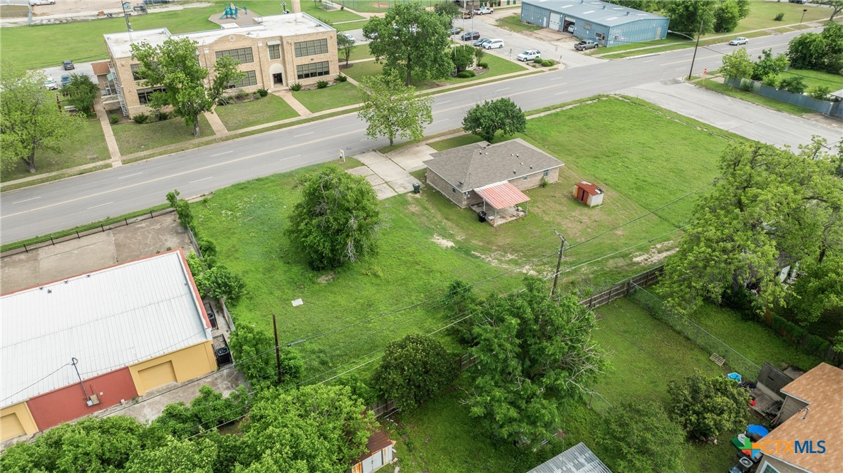 208 North 8th Street Temple, TX 76501 - Photo 7 of 13 an aerial view of a house with yard lake and outdoor seating