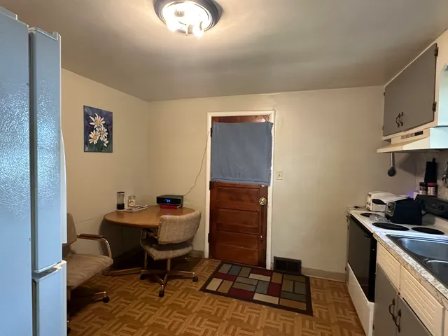 a work room with furniture and wooden floor