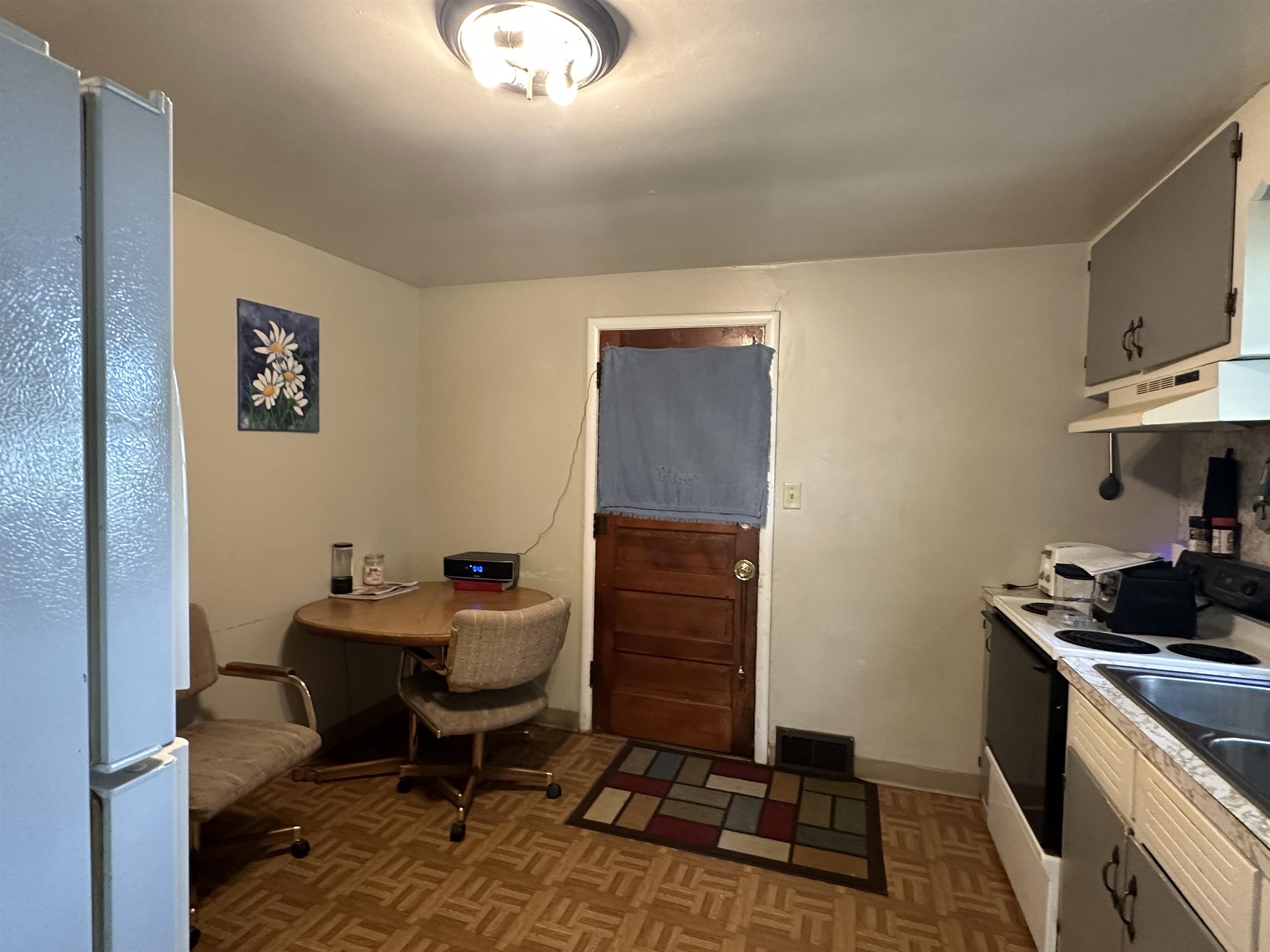 627 West Homer Street Freeport, IL 61032 - Photo 13 of 15 a work room with furniture and wooden floor