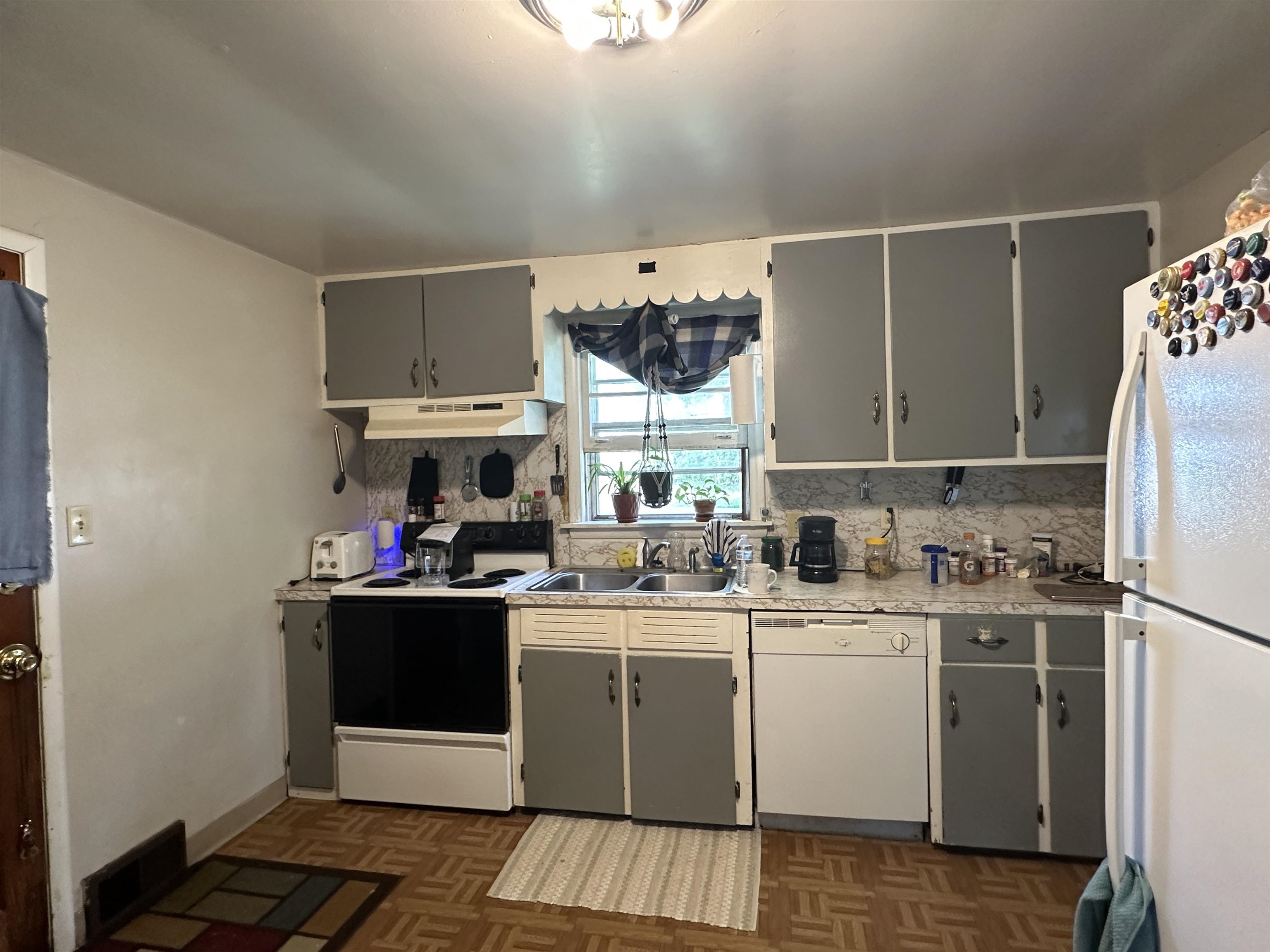 627 West Homer Street Freeport, IL 61032 - Photo 14 of 15 a kitchen with a sink cabinets and window