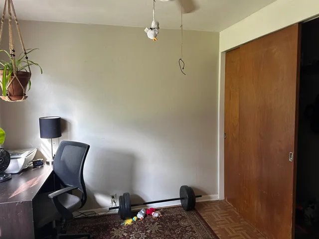 a bathroom with a toilet and a mirror