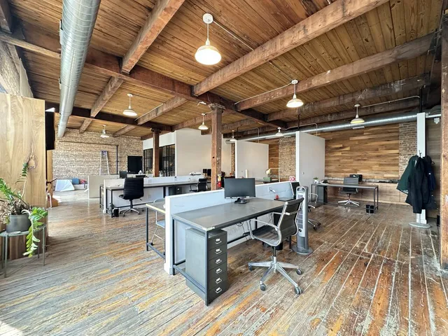 a view of a patio with table and chairs barbeque with wooden floor