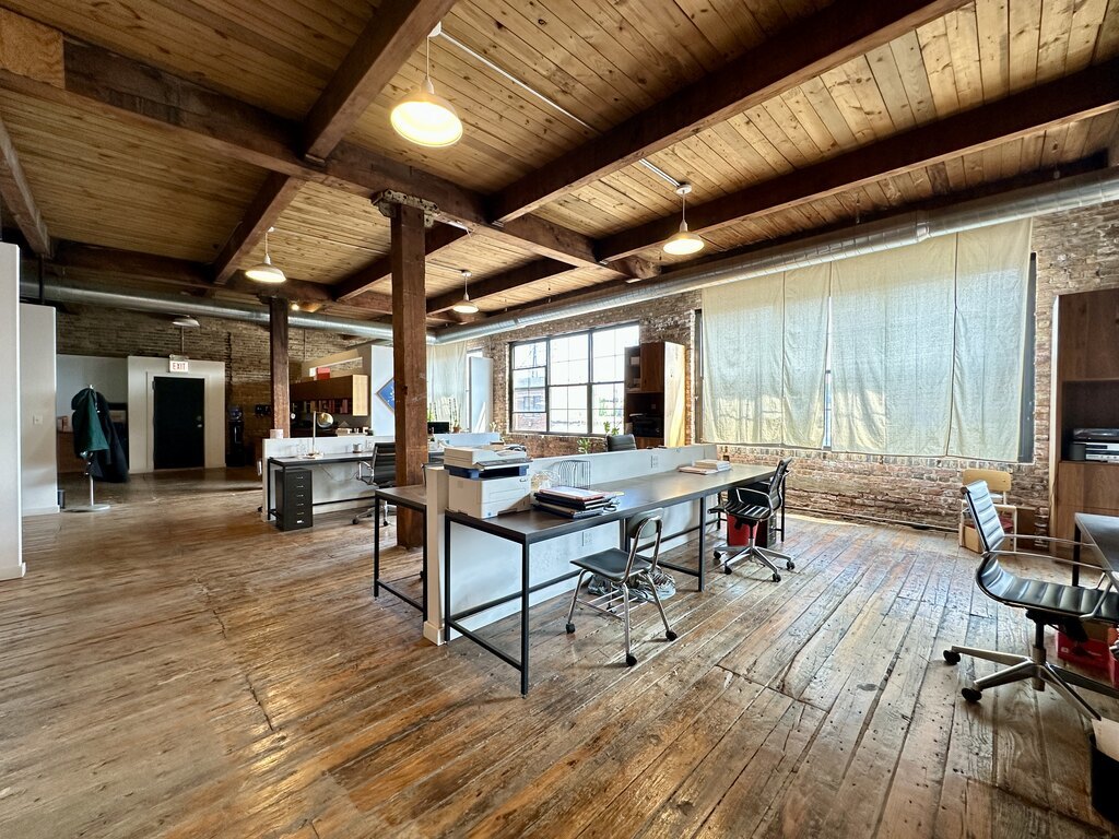3124 West Carroll Avenue, Unit 2F Chicago, IL 60612 - Photo 16 of 20 a living room with furniture and a wooden floor