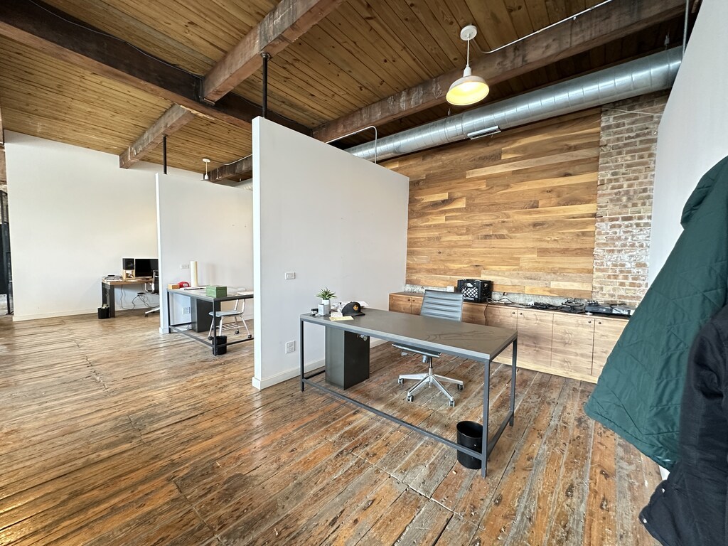 3124 West Carroll Avenue, Unit 2F Chicago, IL 60612 - Photo 17 of 20 a room with wooden floor and furniture