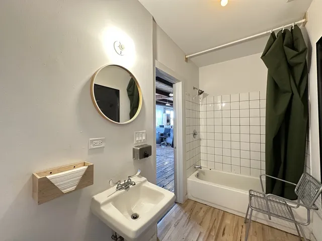 a bathroom with a sink a bathtub and a shower
