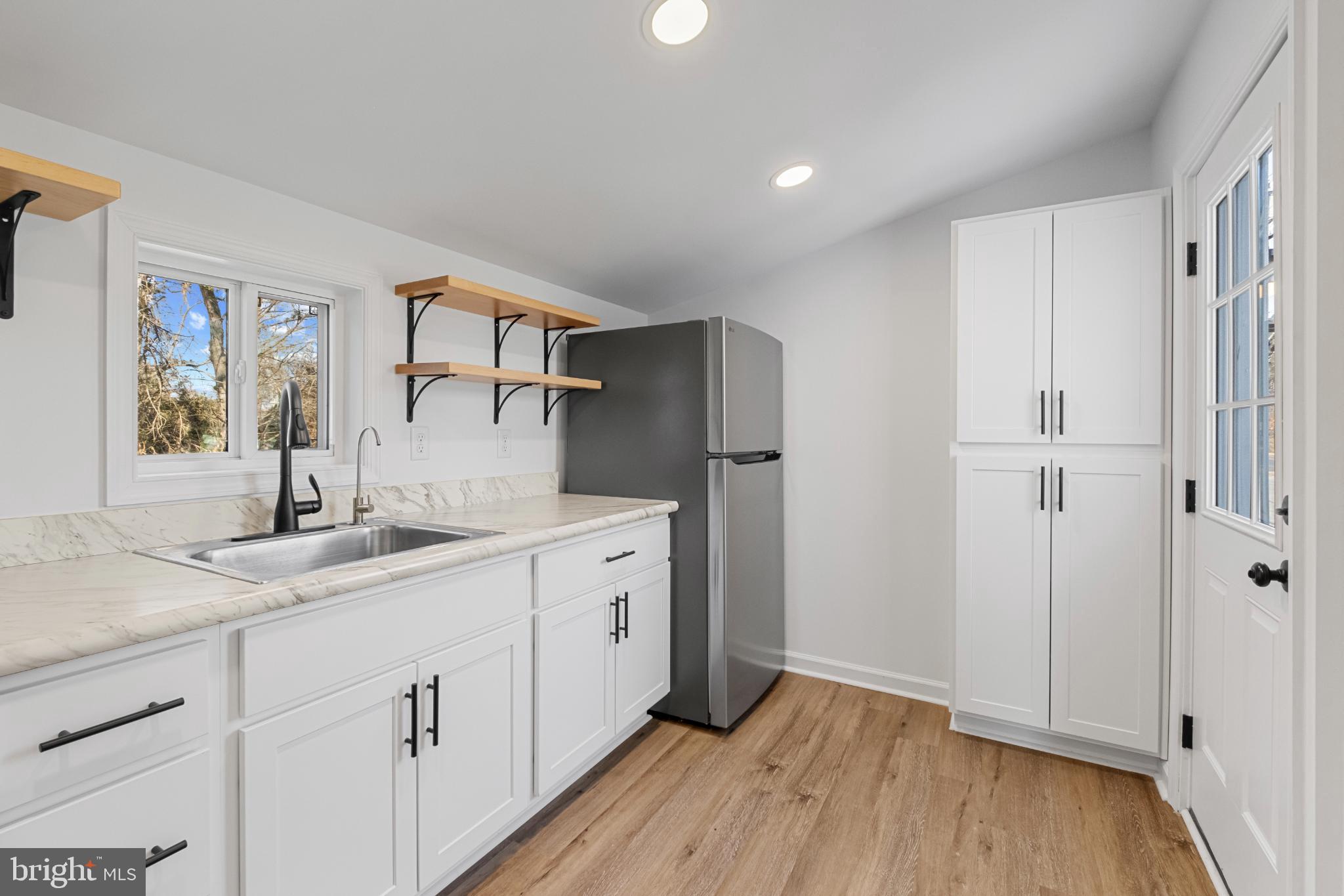 28276 Riverside Drive Salisbury, MD 21801 - Photo 10 of 30 Modern kitchen with sleek finishes.