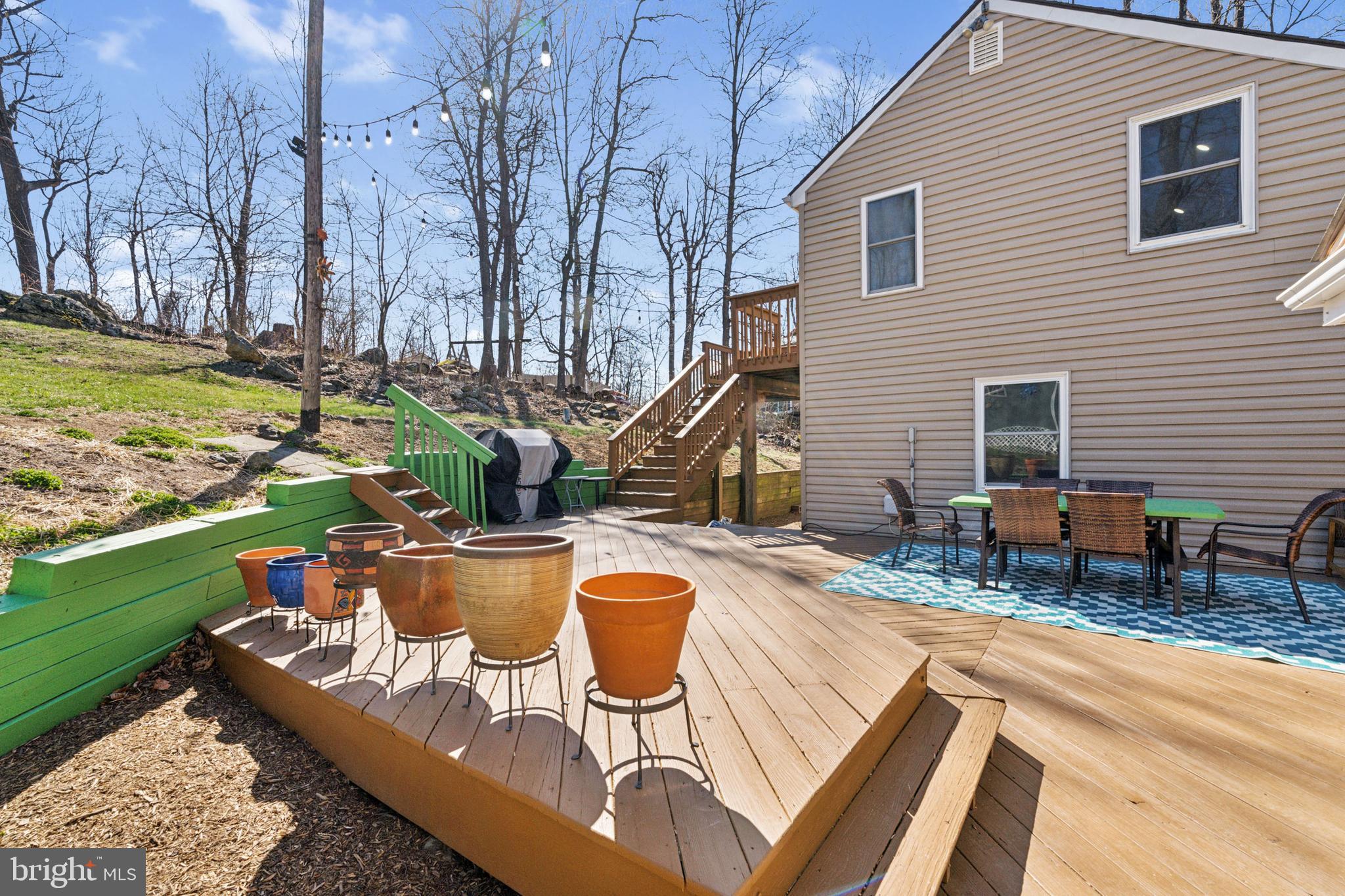 44 Luchase Road Linden, VA 22642 - Photo 34 of 52 a view of a backyard with sitting area and fire pit