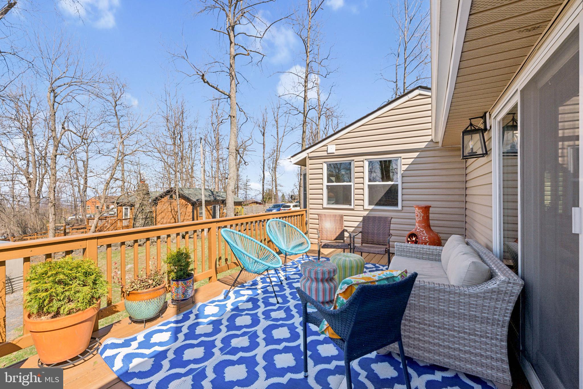 44 Luchase Road Linden, VA 22642 - Photo 5 of 52 a view of balcony with chairs and potted plants