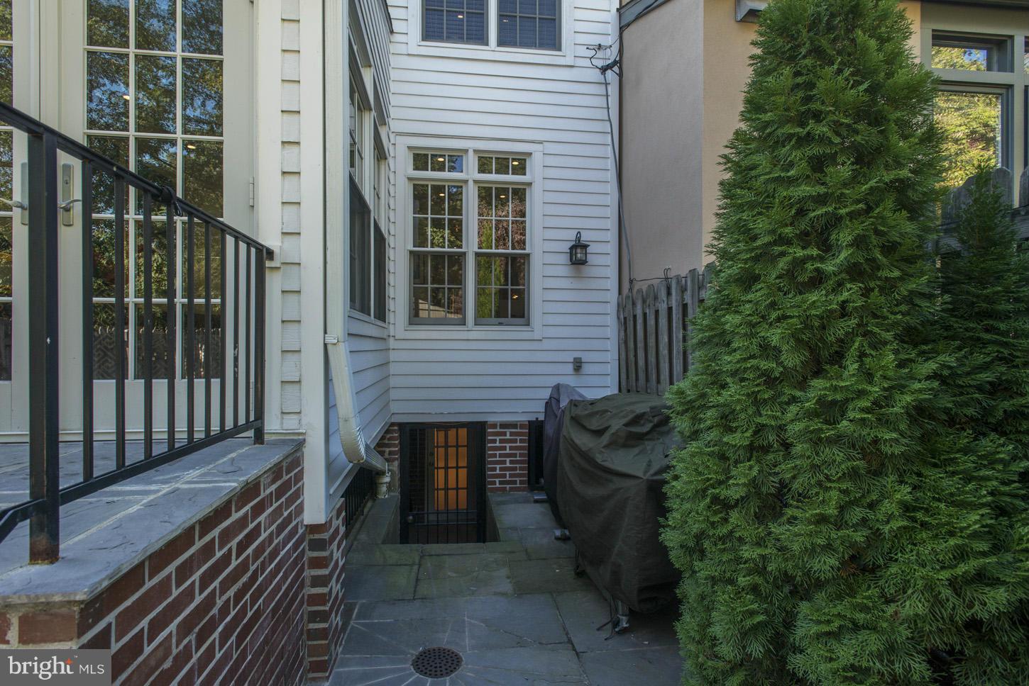 3813 T Street Northwest Washington, DC 20007 - Photo 22 of 24 a front view of a house with a garden