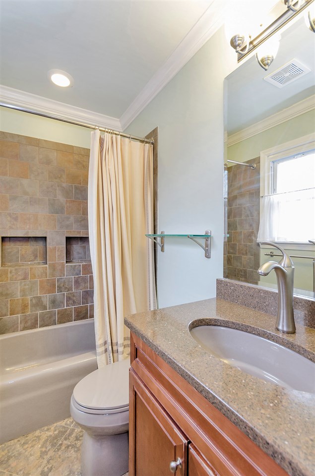 19 Valley Road Ruckersville, VA 22968 - Photo 8 of 30 a bathroom with a granite countertop sink toilet and shower