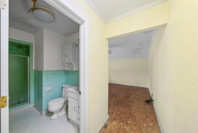 a bathroom with a sink a toilet and vanity