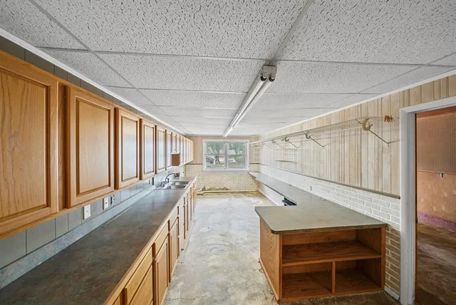 a bathroom with a glass shower door