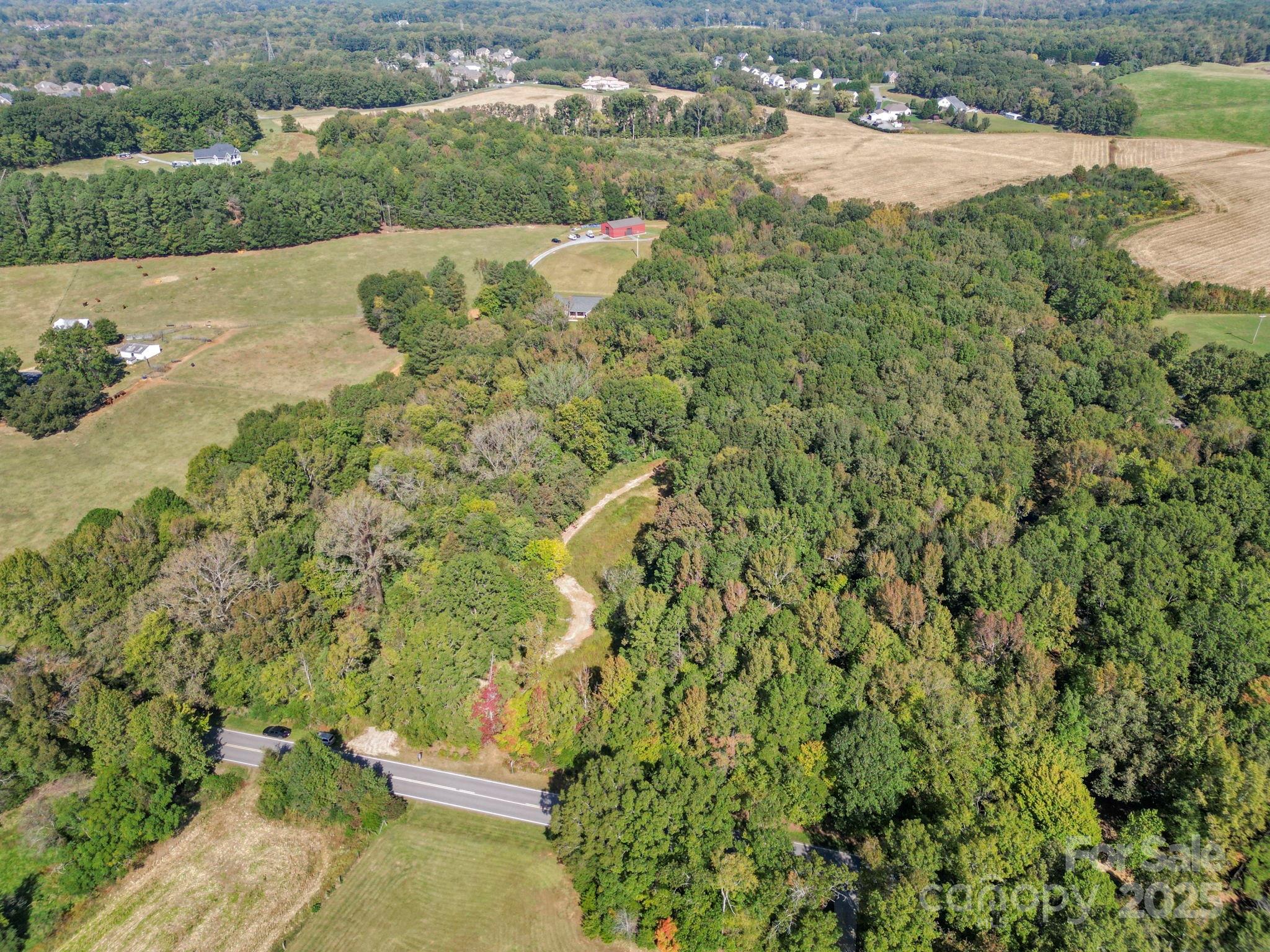 5908 Will Plyler Road Waxhaw, NC 28173 - Photo 4 of 12 an aerial view of residential houses with outdoor space and trees
