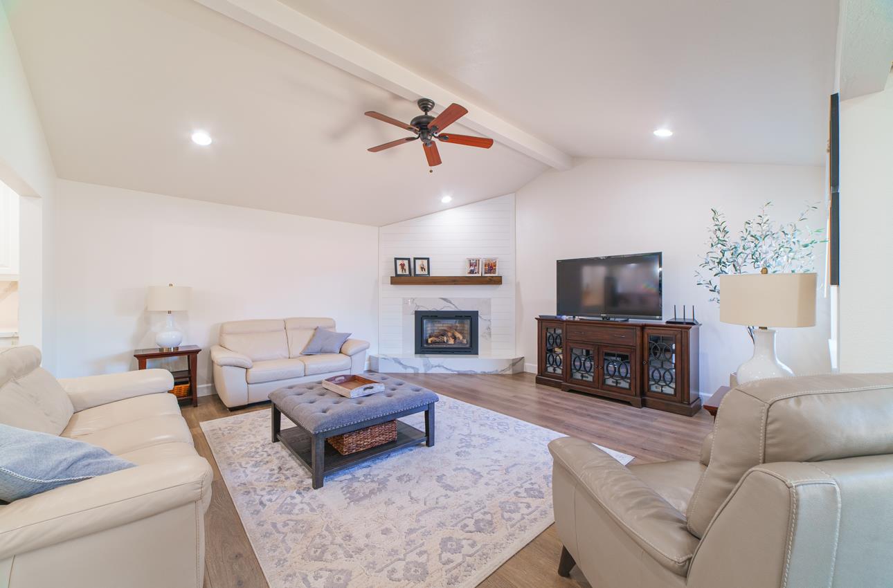 731 La Mesa Drive Salinas, CA 93901 - Photo 16 of 43 a living room with furniture a fireplace and a flat screen tv