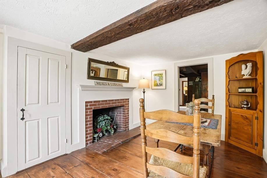 52 Elm Street Upton, MA 01568 - Photo 8 of 42 a living room with furniture and a fireplace