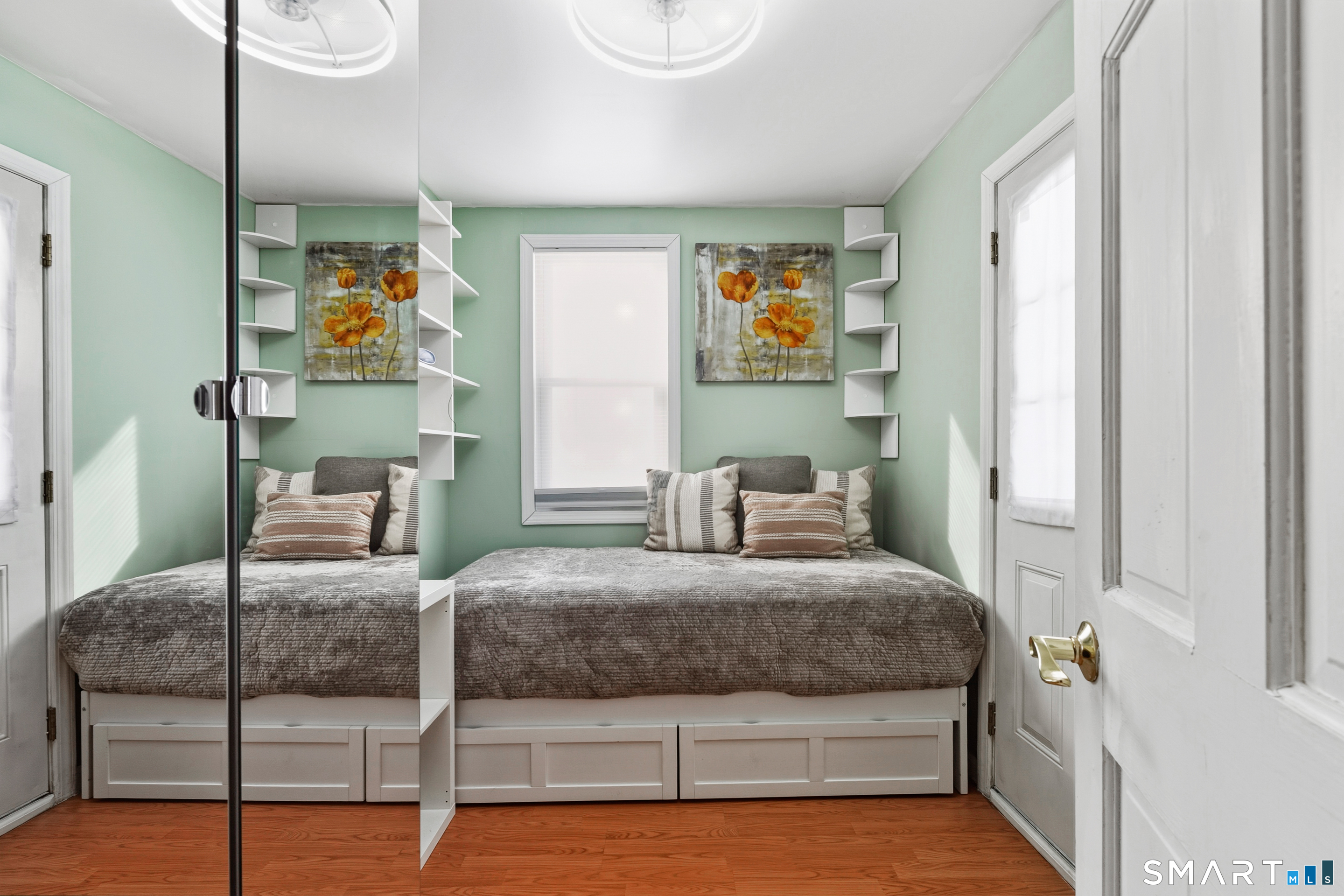 14 Bantam Road New Fairfield, CT 06812 - Photo 12 of 42 a bedroom with a bed and wooden floor