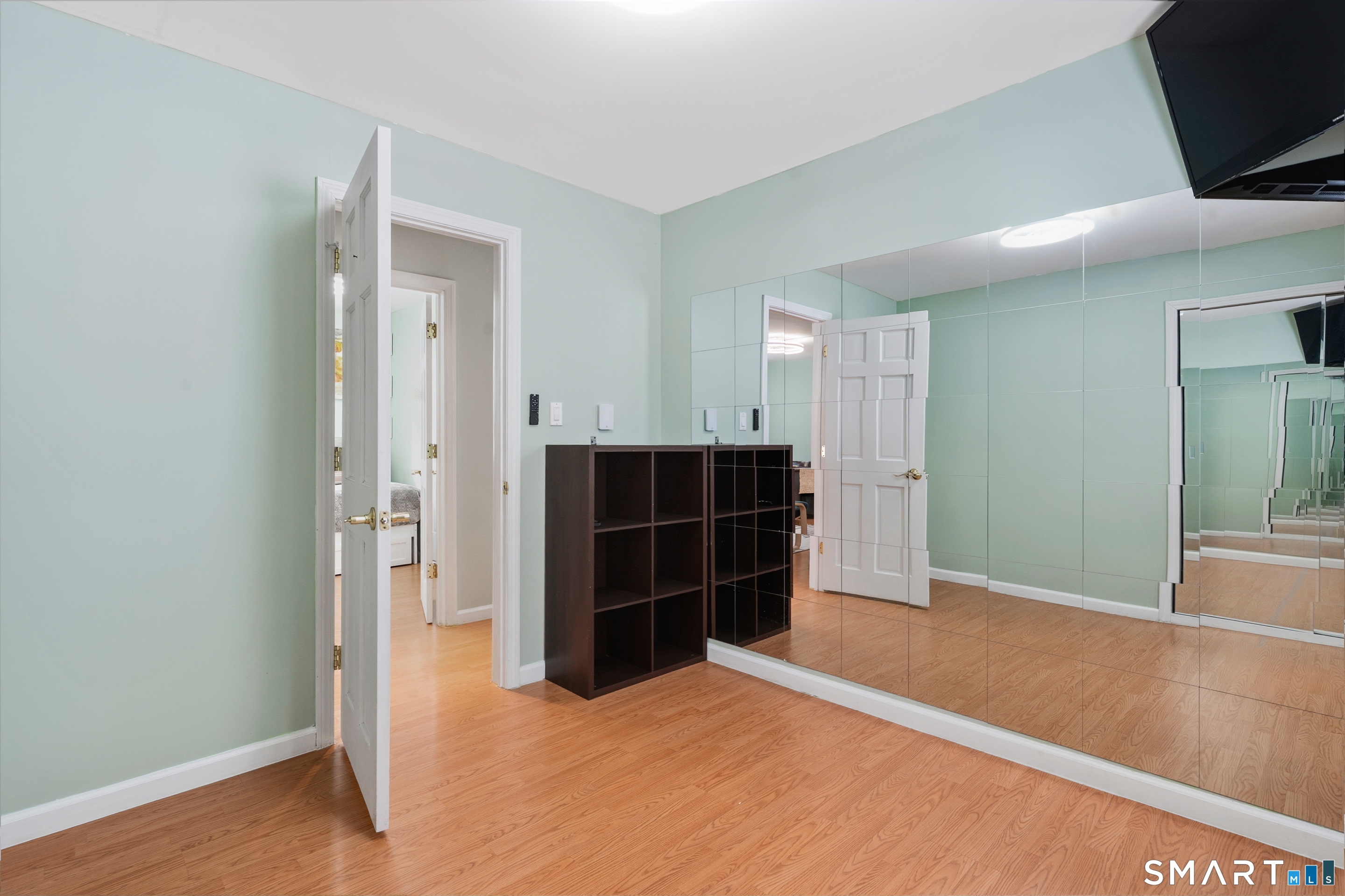 14 Bantam Road New Fairfield, CT 06812 - Photo 14 of 42 a view of room with wooden floor and flat screen tv