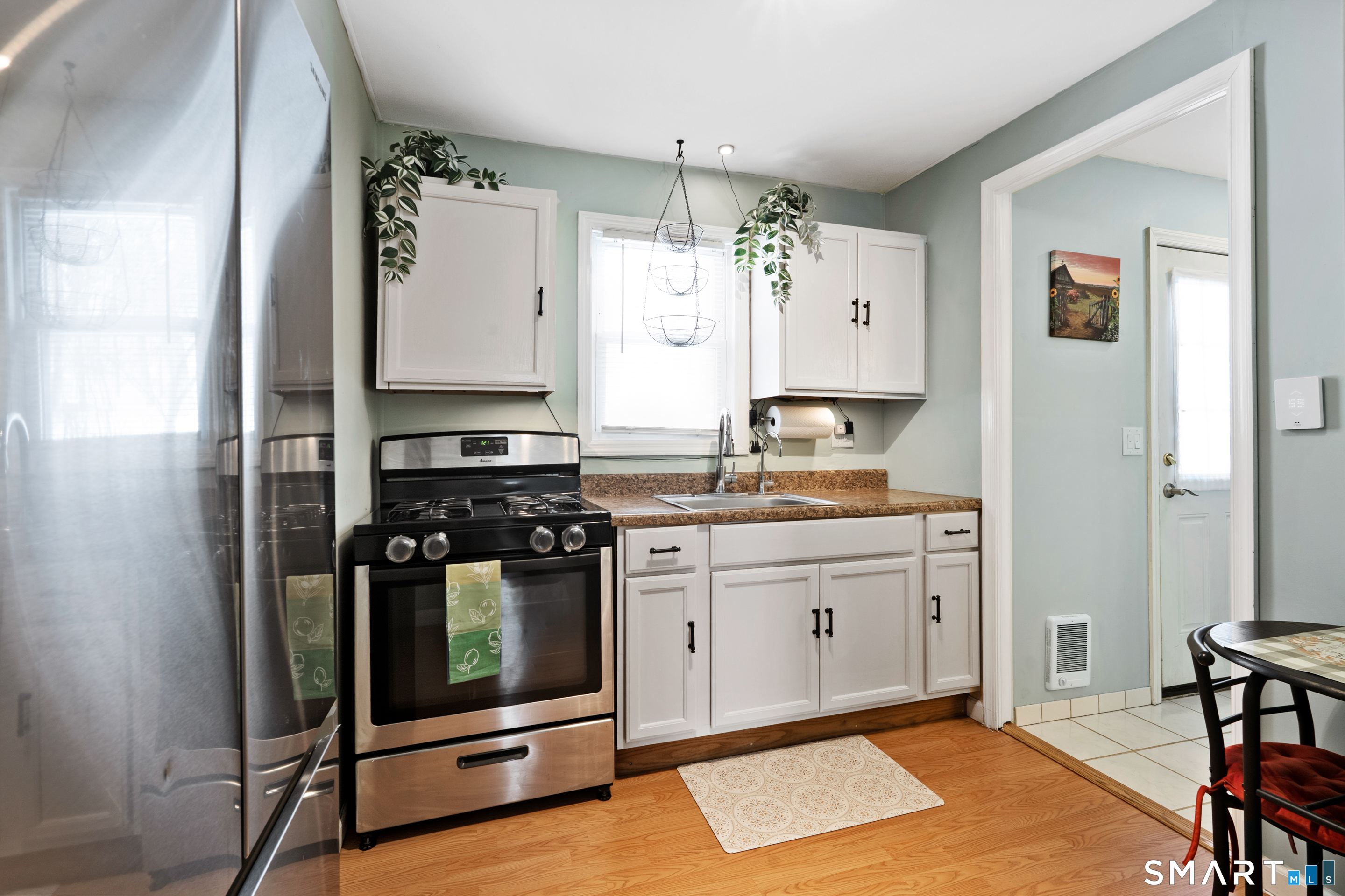 14 Bantam Road New Fairfield, CT 06812 - Photo 20 of 42 a kitchen with granite countertop a stove and a refrigerator
