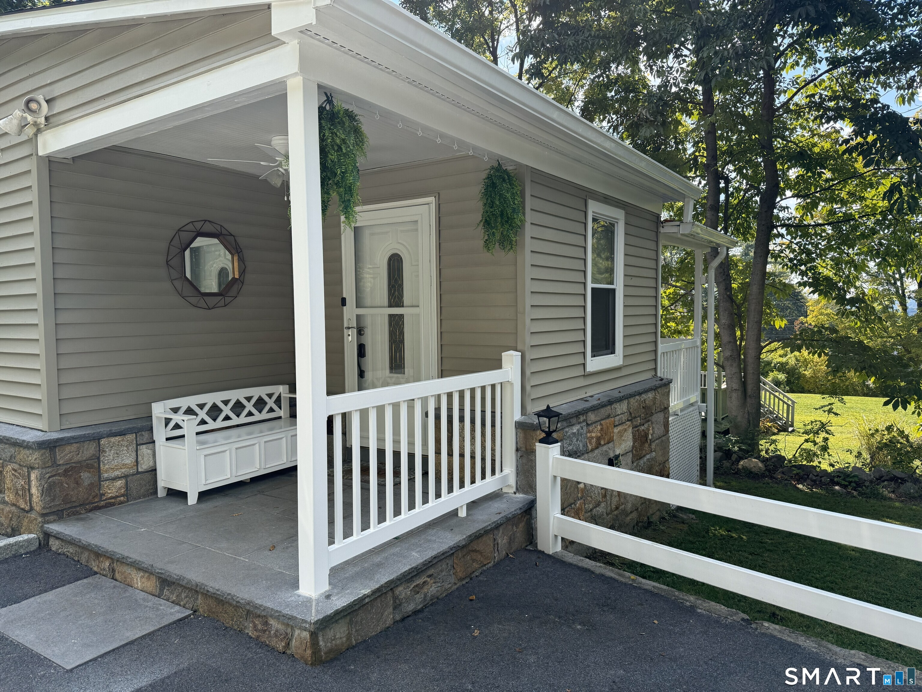 14 Bantam Road New Fairfield, CT 06812 - Photo 2 of 42 a view of a porch with a bench