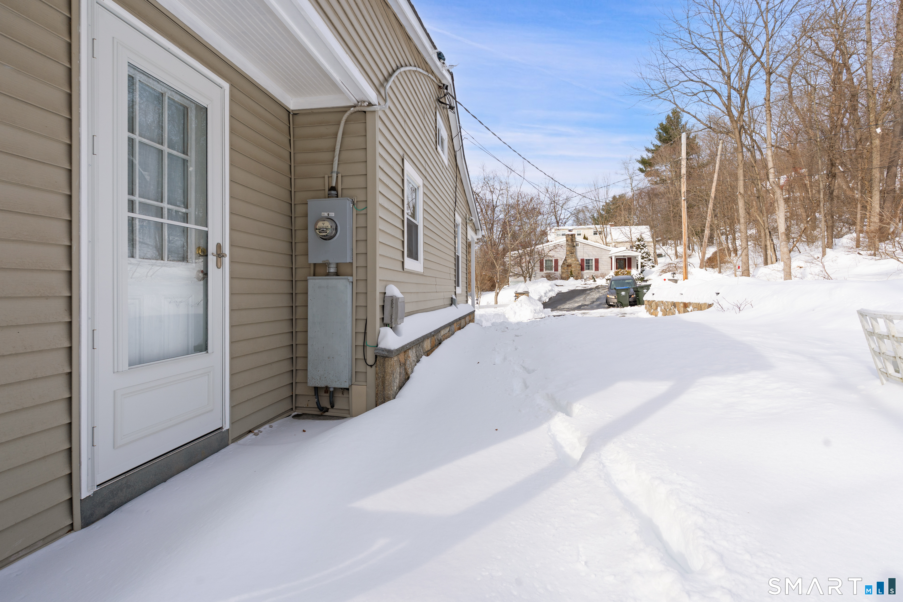 14 Bantam Road New Fairfield, CT 06812 - Photo 34 of 42 a view of a city street with tall buildings