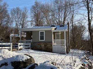 14 Bantam Road New Fairfield, CT 06812 - Photo 38 of 42 a front view of a house with a large tree in front of it