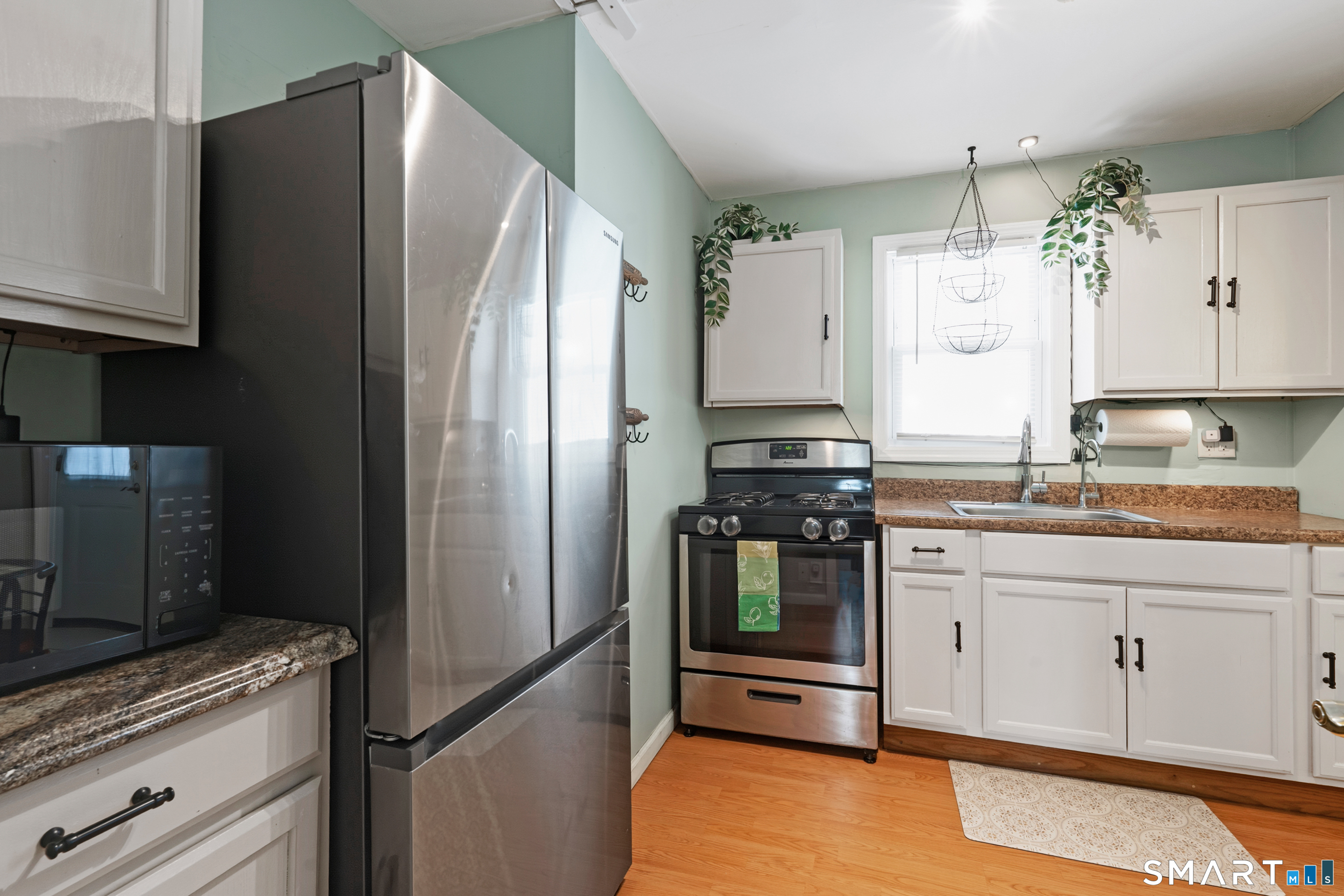 14 Bantam Road New Fairfield, CT 06812 - Photo 4 of 42 a kitchen with granite countertop a refrigerator and a sink