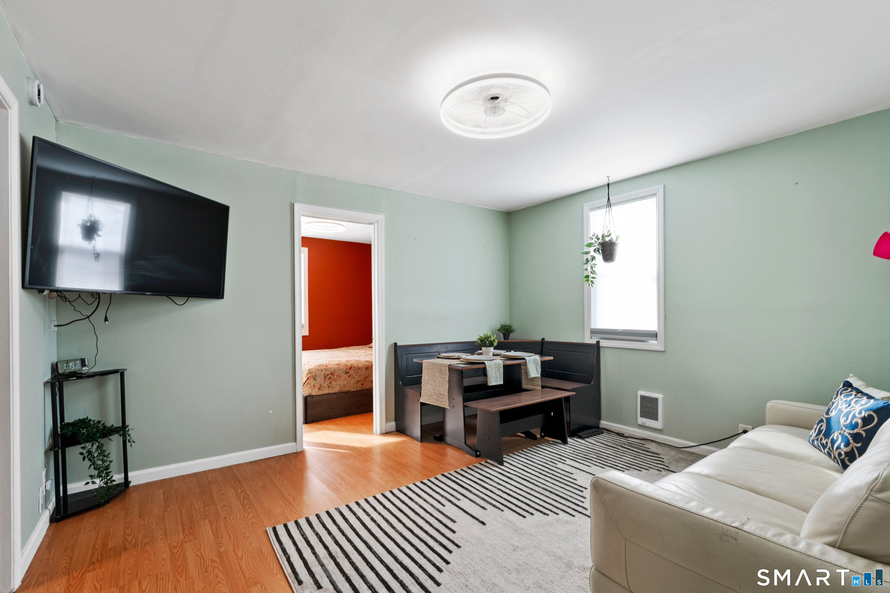 14 Bantam Road New Fairfield, CT 06812 - Photo 7 of 42 a bedroom with furniture and a flat screen tv