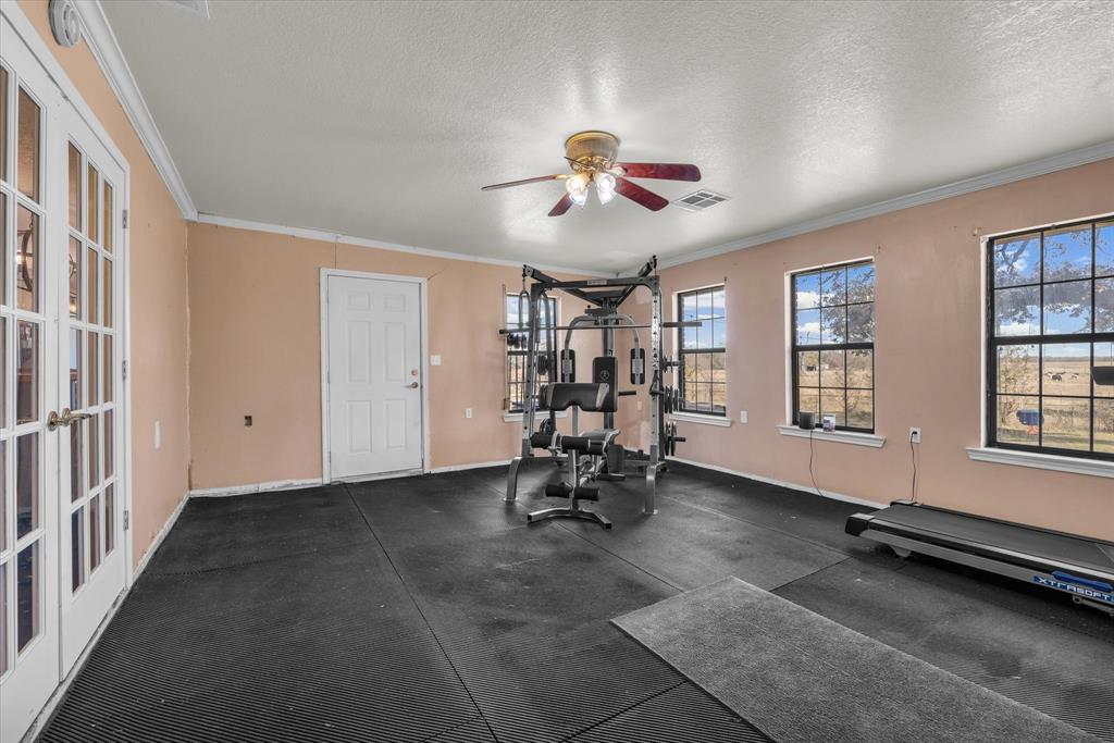 7633 South 3rd St Road Waco, TX 76706 - Photo 28 of 33 a view of a room with gym equipment and windows