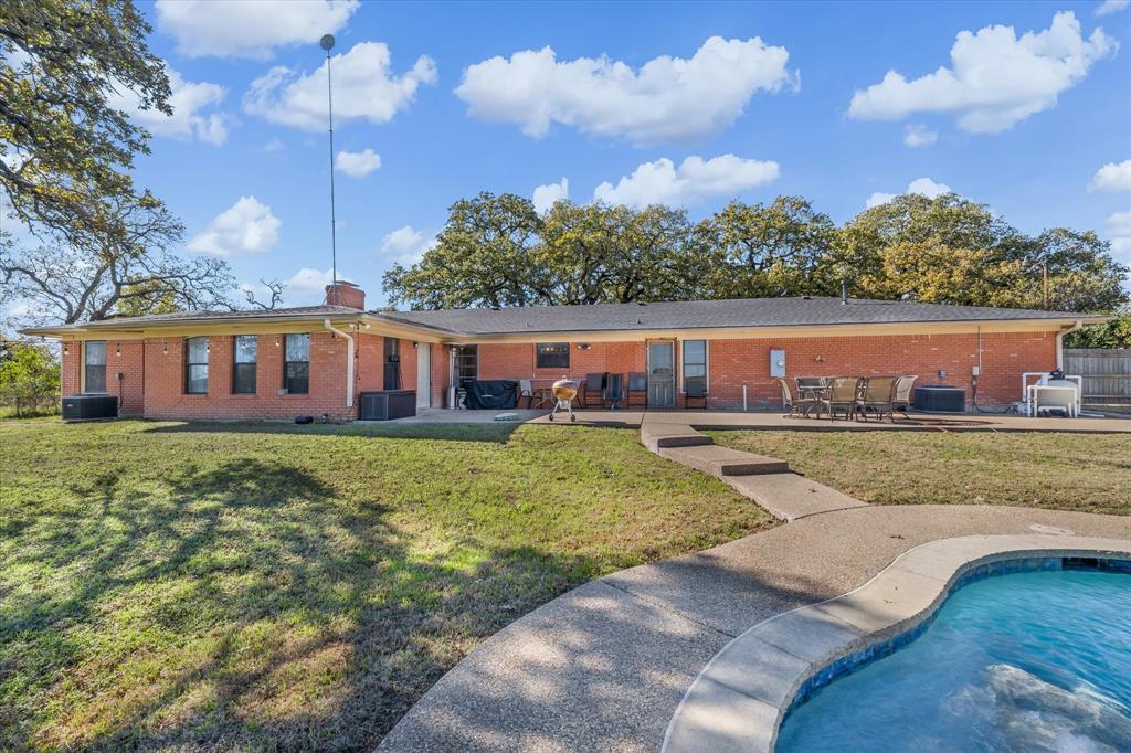 7633 South 3rd St Road Waco, TX 76706 - Photo 3 of 33 a view of a house with a swimming pool