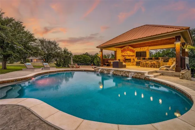a view of a swimming pool with a patio