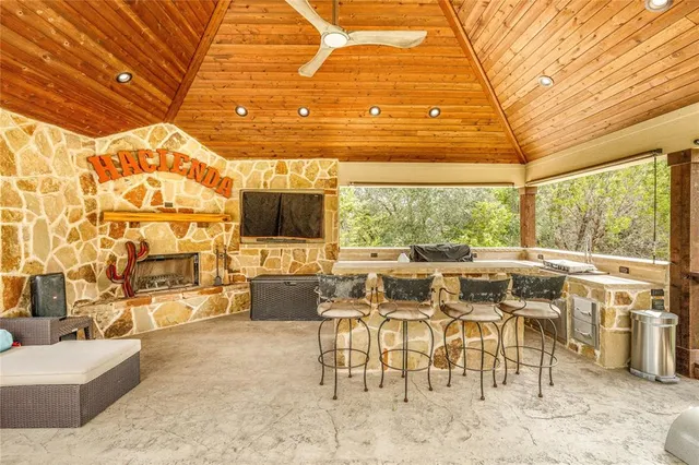 a living room with lots of furniture and a large window