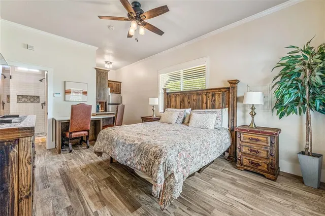 a bed room with a bed and a potted plant