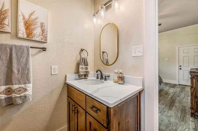 a bathroom with a sink and a mirror