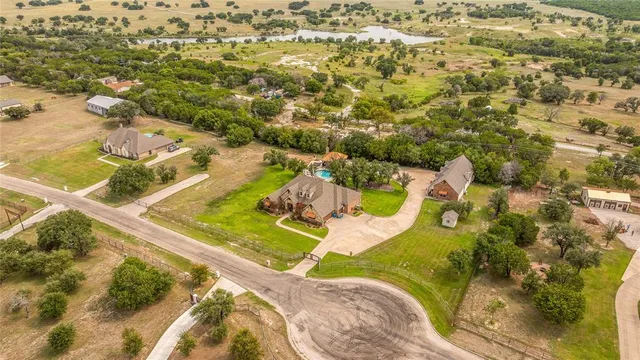 an aerial view of a house with swimming pool