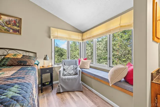 a kitchen with stainless steel appliances granite countertop a sink and a refrigerator
